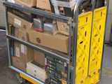 a cart full of boxes and boxes sitting on top of it