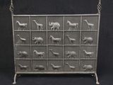 a metal screen with animals on it on a black background