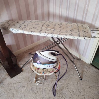 a ironing board and a small ironing board on a stand