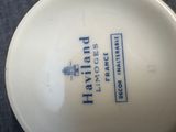 a white bowl with a blue and white design on it