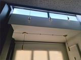three light bulbs hanging from the ceiling in a room