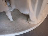a close up view of a toilet with a white cover