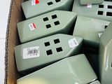 a lot of green appliances in a box on the floor