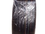 an image of a black vase with a plastic wrap around it