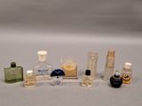 a lot of small bottles of perfume on a table