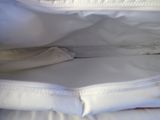 a close up of a white bag with a banana inside of it
