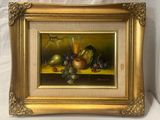 tableau représentant une nature morte composée de fruits et d'un verre posés sur une table