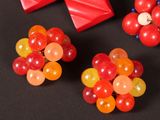 three different types of candies on a black surface
