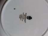 a white plate with a black and white design on it