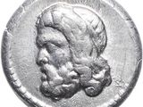 a silver coin with an image of a man ' s head on it