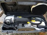 a tool in a case that is sitting on the ground