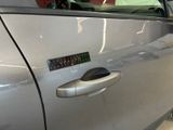 a close up of a car door handle with a sticker on it