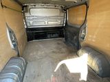 the inside of a van with the door open showing the interior of the van