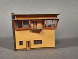 a small model of a building with a balcony and balconies