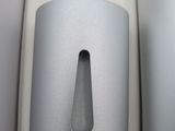 a toilet paper dispenser in the corner of the bathroom