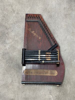 an overhead view of a musical instrument on a concrete surface