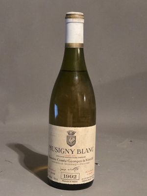 a bottle of wine that is sitting on a table