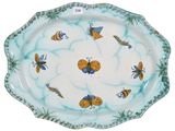 a picture of a plate with a pattern of bees on it