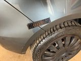 a close up of a car tire with a sticker on it