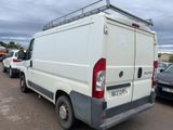 a white van that is parked in a parking lot