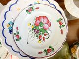 many plates that are sitting on a table