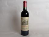 a bottle of wine that is sitting on a table
