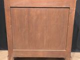 an old wooden chest with a drawer on top of it