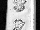 a silver spoon with a picture of a man and a woman on it