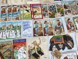 many different types of postcards on the table