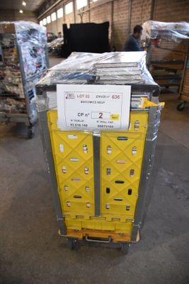 a cart with a lot of boxes on it in a warehouse