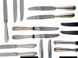 many different types of knifes and knives on the table
