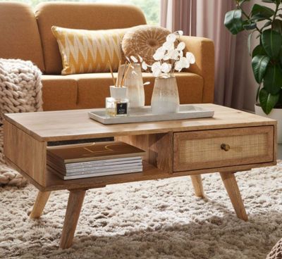 a coffee table with two drawers on it in a living room