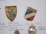 a lot of badges that are on a piece of paper