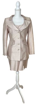 an image of a dress and jacket on a mannequin
