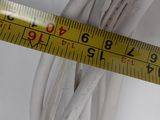 a close up of a measuring tape on a white surface