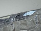 a close up of a clear glass container with a toothbrush