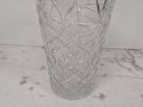 a glass vase that is sitting on a table