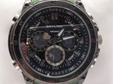 a close up of a watch on a wrist on a white cloth
