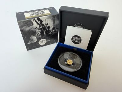 une boîte noire contenant une pièce d'or