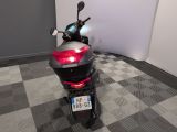 a motorcycle that is parked in a room with a checkered floor