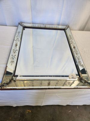 an image of a mirror sitting on top of a white sheet