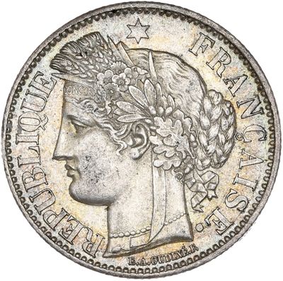 a close up of a coin with a woman ' s head on it