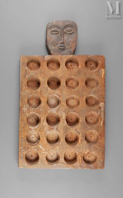 an image of a wooden block with a face on it
