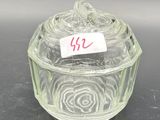 a glass box with a label on it on a table