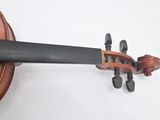 an image of a close up of a violin on a white surface