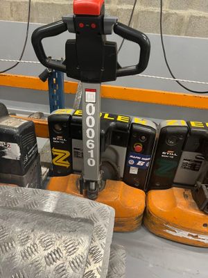 a picture of a forklift in a warehouse with other tools