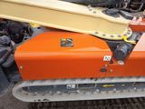a yellow and orange bulldozer sitting on the ground