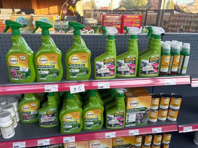 many bottles of cleaning products on the shelves in the store