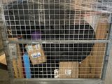 a metal cage with a bunch of boxes inside of it