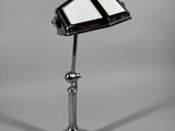 an image of a desk lamp with a cell phone on it